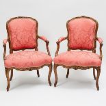 Pair of French Provincial Carved Walnut Fauteuils, 19th/early 20th century, height 33.5 in — 85.1 cm