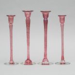 Four Robert Held (American-Canadian, b.1943), Iridescent Pink Glass Candlesticks, 20th century, larg