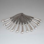 Eleven Georgian Silver Pistol Handled Table Knives, late 18th/early 19th century, length 10.5 in — 2