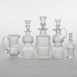 Four Edinburgh Crystal 'Thistle' Pattern Cut Glass Decanters and a Pitcher, 20th century, largest he