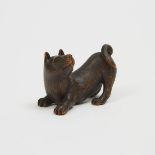 A Wood Netsuke of a Dog, Signed Shinzan, length 1.7 in — 4.3 cm