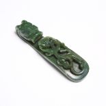 A Spinach Jade 'Dragon' Belt Hook, Qing Dynasty, 清 翠玉雕'苍龙教子'带钩, length 4.3 in — 11 cm