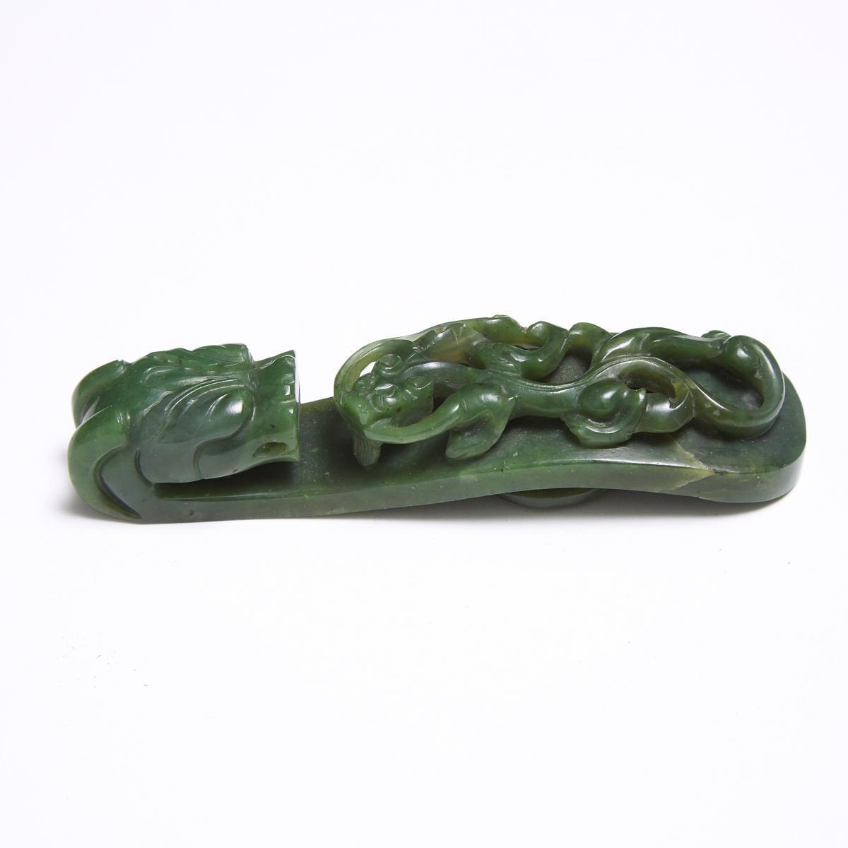 A Spinach Jade 'Dragon' Belt Hook, Qing Dynasty, 清 翠玉雕'苍龙教子'带钩, length 4.3 in — 11 cm - Image 2 of 4