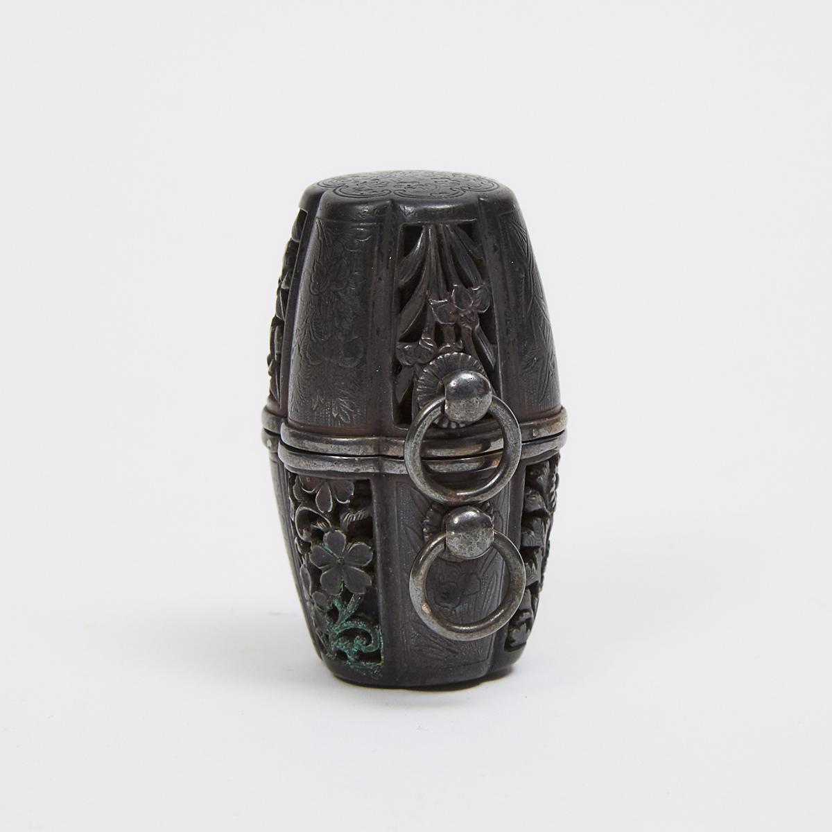 A Shakudo Metal Netsuke of a Barrel with Silver Fitting and Interior Compass, Meiji Period, height 1