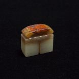 A Pale Celadon and Russet Jade Double Seal, 青白玉双联印, 1.5 x 1.7 x 0.7 in — 3.7 x 4.2 x 1.9 cm