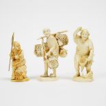 A Group of Three Ivory Okimono of Fishermen and a Merchant, Meiji Period, tallest height 5 in — 12.6