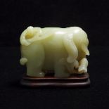 A Celadon Jade 'Elephant and Boy' Carving, 青玉雕'童子戏象'摆件, length 3.4 in — 8.6 cm
