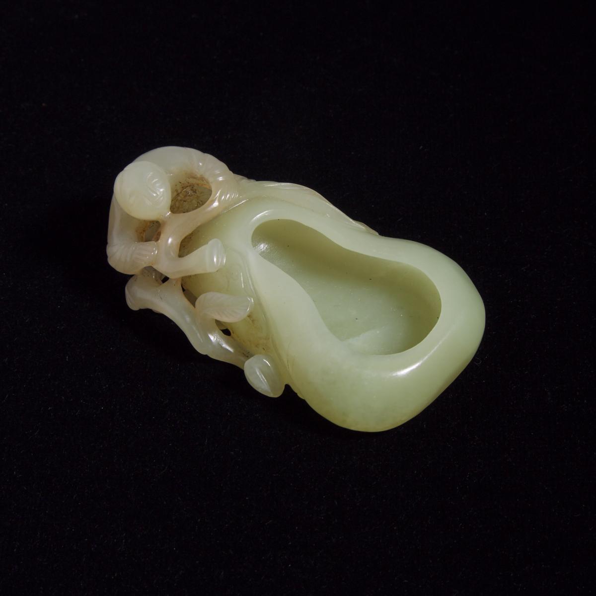 A Celadon Jade 'Double-Gourd and Boy' Washer, 青玉雕童子葫芦形洗, length 3.5 in — 8.9 cm