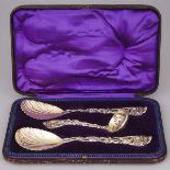 Pair of Victorian Silver-Gilt Vine Pattern Berry Spoons and a Sifting Ladle, John Aldwinckle & Thoma