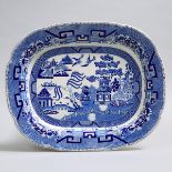 Staffordshire Blue-Printed Willow Pattern Oval Platter, early 19th century, length 22 in — 55.8 cm