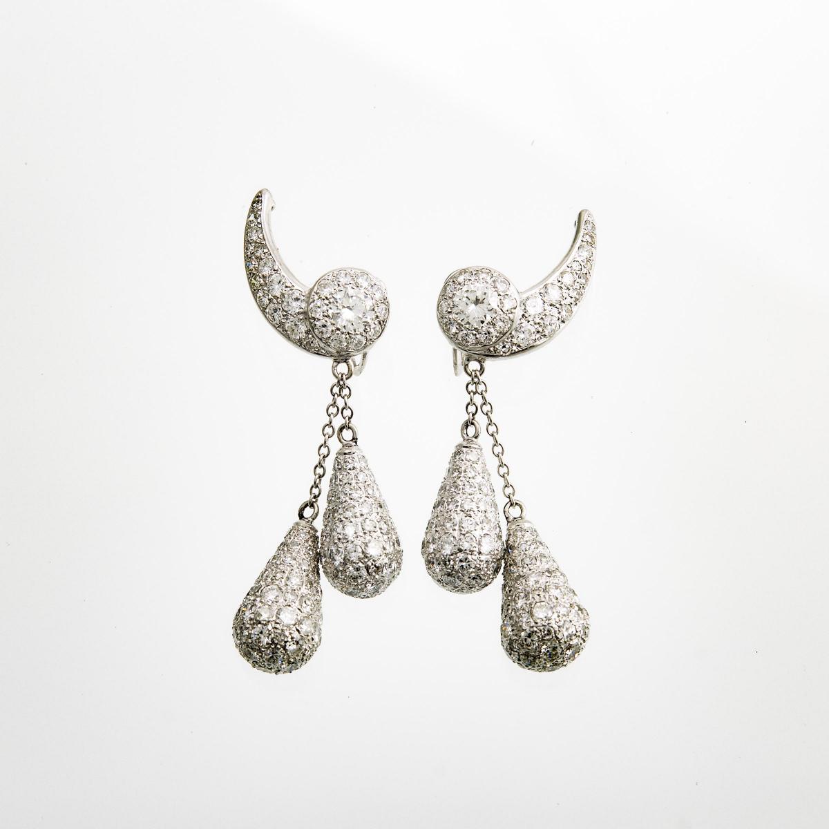 Pair Of 14k White Gold Screw-Back Drop Earrings, each centering a brilliant cut diamond (approx. 0.3