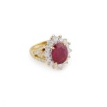 18k Yellow Gold Ring, set with an oval cut ruby (approx. 2.00ct.) encircled by 28 brilliant cut diam