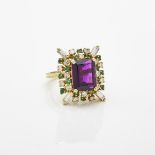 18k Yellow Gold Ring, set with an emerald cut amethyst encircled by 4 small baguette cut & 16 small