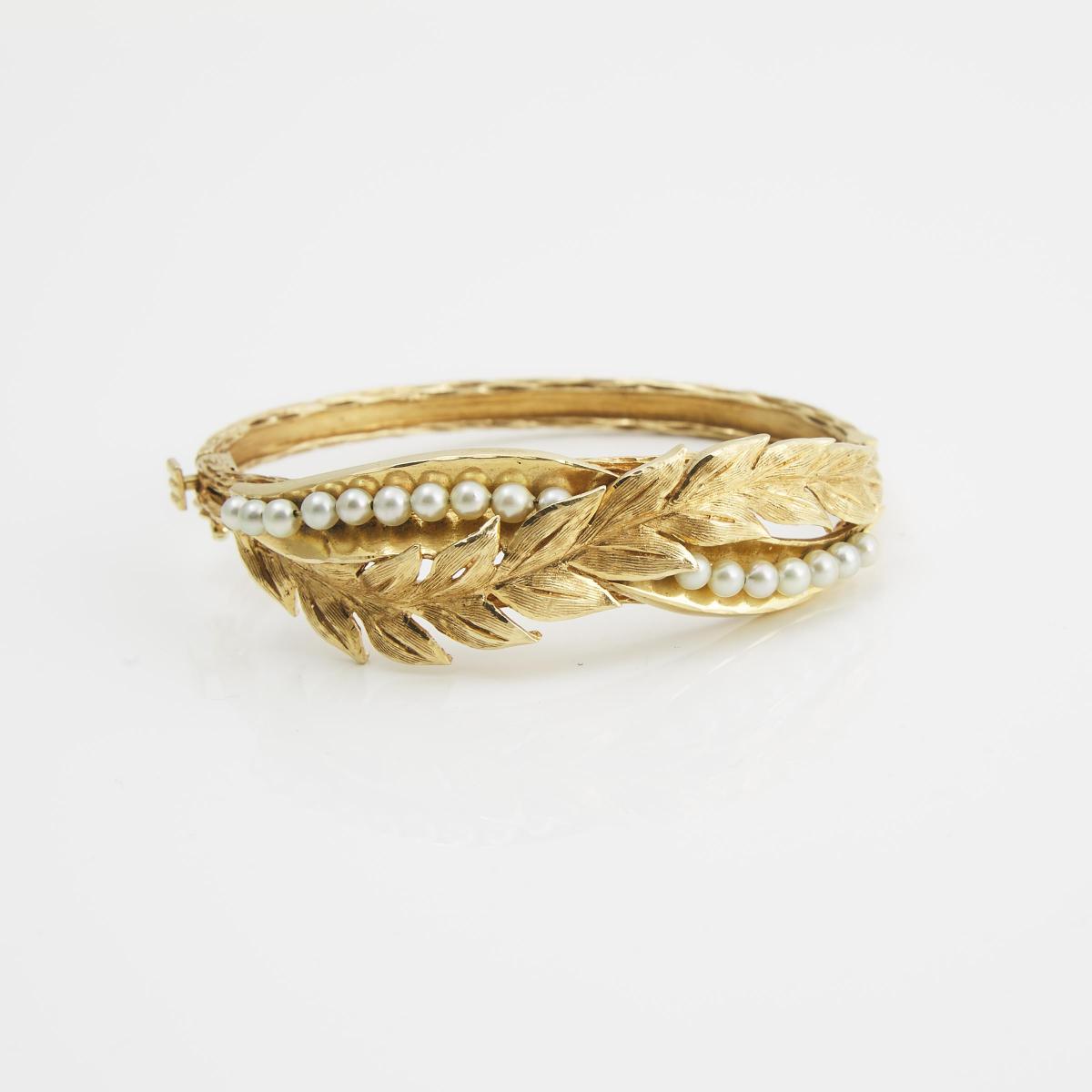 14k Yellow Gold Hinged Bangle, formed in a foliate motif and set with 18 small cultured pearls