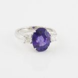 Platinum Ring, set with an oval cut purple sapphire (4.97ct.) and 2 brilliant cut diamonds (approx.