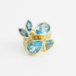 18k Yellow Gold Cocktail Ring, set with 5 pear, marquise, and trilliant cut blue topaz and 11 brilli