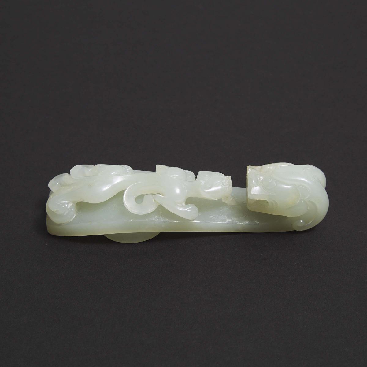 A Mottled White Jade Belt Hook, Qing Dynasty, 清 白玉雕苍龙教子带钩, length 3.7 in — 9.5 cm - Image 2 of 3
