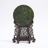 A Spinach-Green Jade 'Phoenix and Plum Blossom' Table Screen, 碧玉雕'凤梅图'圆插屏, diameter 8.7 in — 22.2 cm