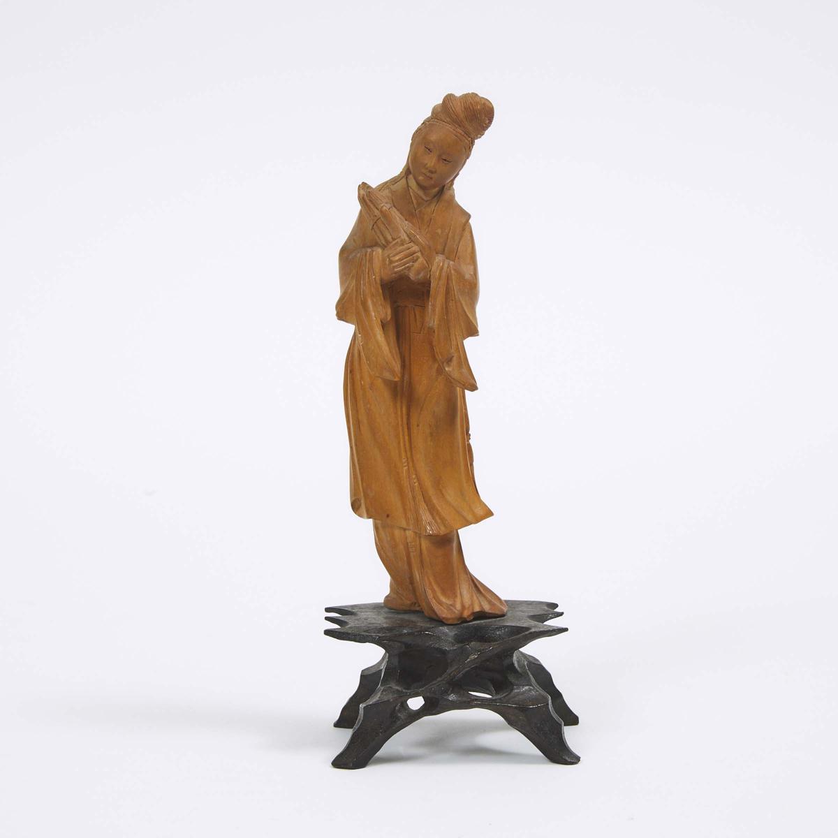 A Chinese Boxwood Carving of Female Musician, 20th Century, 二十世纪 黄杨木雕持笙仕女, height 7.3 in — 18.5 cm