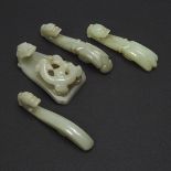 A Group of Four Small Celadon Jade 'Dragon' Belt Hooks, 青玉雕龙钩一组四件, longest length 3.3 in — 8.3 cm (4