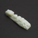 A Mottled White Jade Belt Hook, Qing Dynasty, 清 白玉雕苍龙教子带钩, length 3.7 in — 9.5 cm