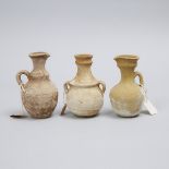 Three Cypro-Phoenician Pottery Juglets, 400 B.C., tallest height 5.4 in — 13.8 cm (3 Pieces)