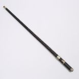 French Carved Ebony System or Gadget Cane, early 20th century, diameter 35.8 in — 91 cm