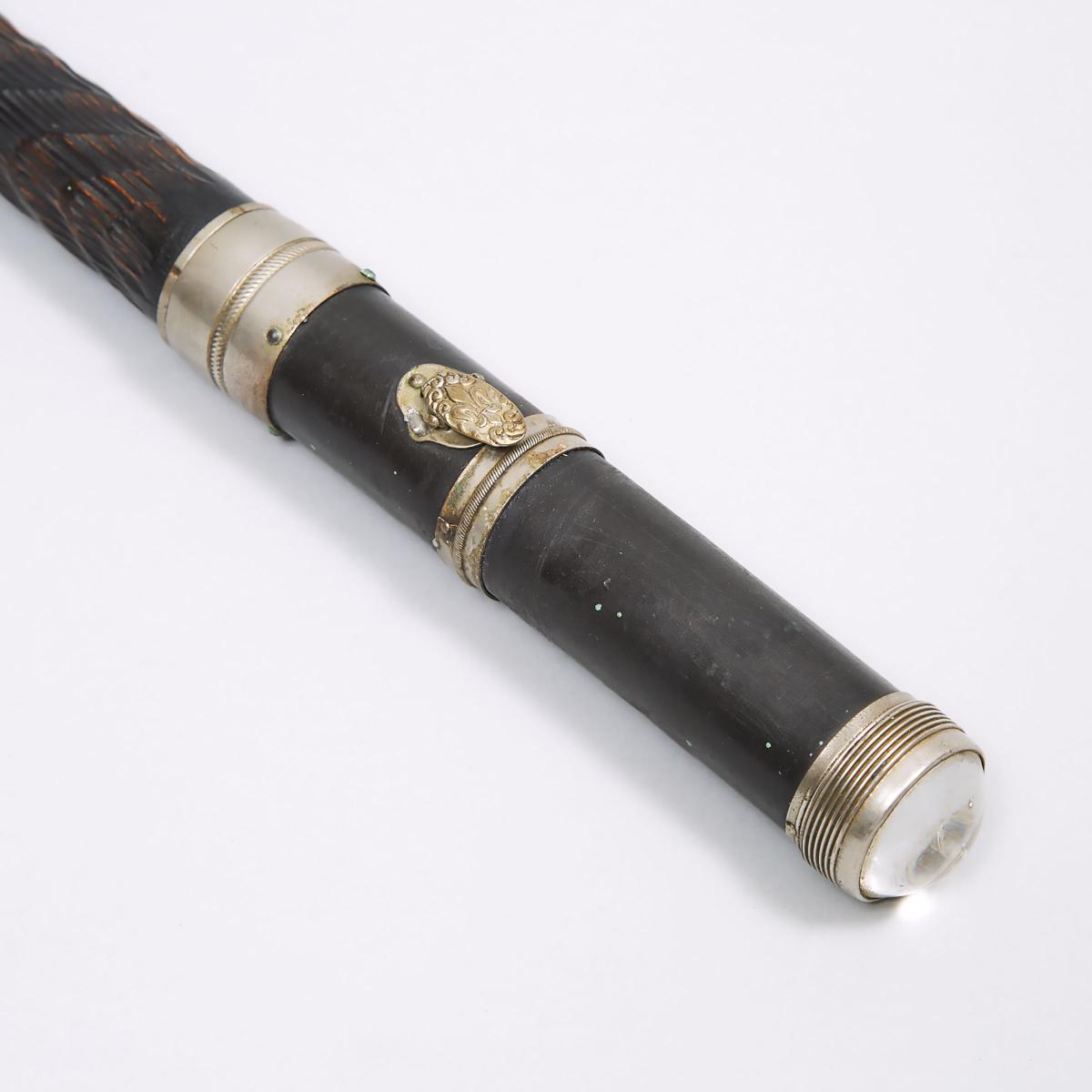 French Carved Ebony System or Gadget Cane, early 20th century, diameter 35.8 in — 91 cm - Image 2 of 3