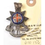 An officer’s enamelled silver cap badge of The R Sussex Regt, HM JRG & Co B’ham 1932, brooch pin;