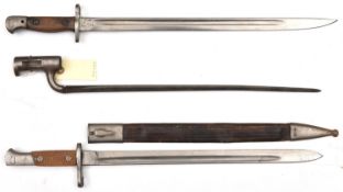A Spanish M1893 bayonet, chequered grips, in scabbard (leather limp); a P1907 bayonet, stamps at