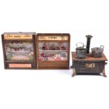 2 1920's-30's miniature shop fronts. One represents F. Bull family butcher and features a meet