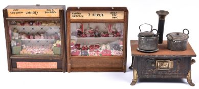 2 1920's-30's miniature shop fronts. One represents F. Bull family butcher and features a meet