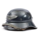 A Third Reich Luftschutz ‘gladiator’ helmet, with smooth dark blue finish and Luftschutz decal,