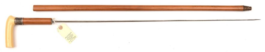 A late 19th century malacca sword cane, locally made hollow triangular section blade, 28”, scroll