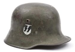 A German M18 steel helmet, with smooth grey finish and added SS decal, faint ‘SE66’ maker’s mark (