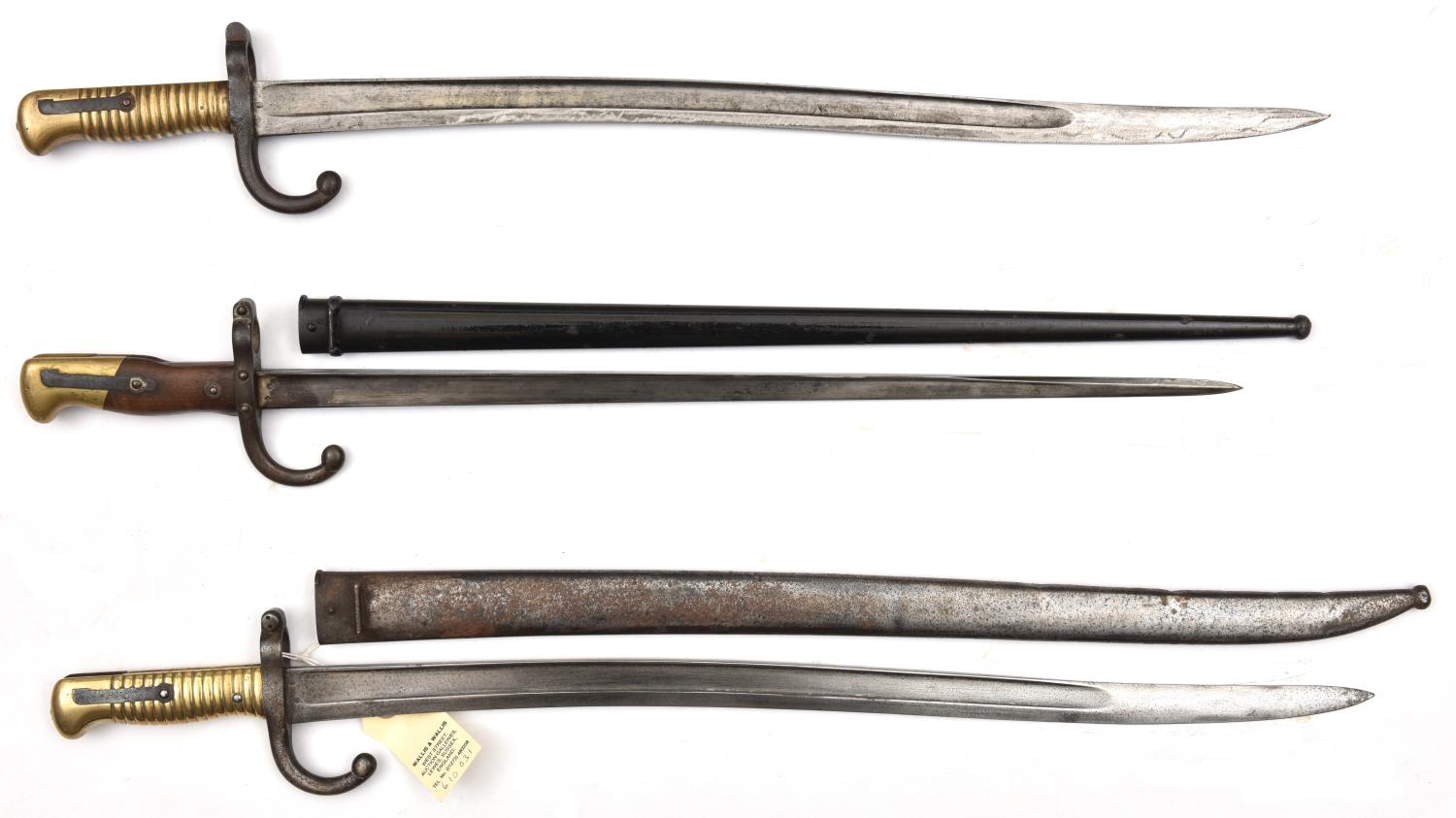 A Chassepot bayonet, d 1872 (?faint) on backstrap, in scabbard, and another marked ‘Mre Nle de Chatt