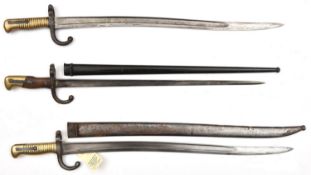 A Chassepot bayonet, d 1872 (?faint) on backstrap, in scabbard, and another marked ‘Mre Nle de Chatt