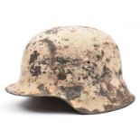 A Third Reich M42 steel helmet, with textured white camouflage finish for use on the Russian