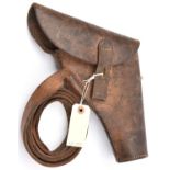 A scarce WWII flap top leather holster for a flare pistol, with leather belt loop stamped ‘E
