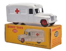 Dinky Toys Daimler Ambulance (253). An example in satin white with red crosses and red wheels. black