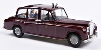 A Spot-On Royal Rolls Royce. In deep maroon with light blue interior, complete with shield,