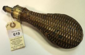 A copper powder flask ‘Overall’, (Riling 422 without rings), common brass top, graduated nozzle 2¼