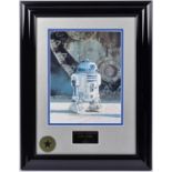 A Star Wars framed photograph of R2D2 with signed autograph by actor Kenny Baker. In gloss black