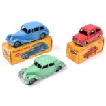 3 Dinky Toys. Riley Saloon (40a) in light green with green wheels. A Triumph 1800 Saloon (151) in