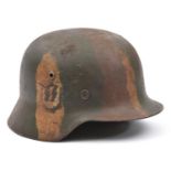 A Third Reich M35 steel helmet, with rough textured WW1 style camouflage finish around single worn