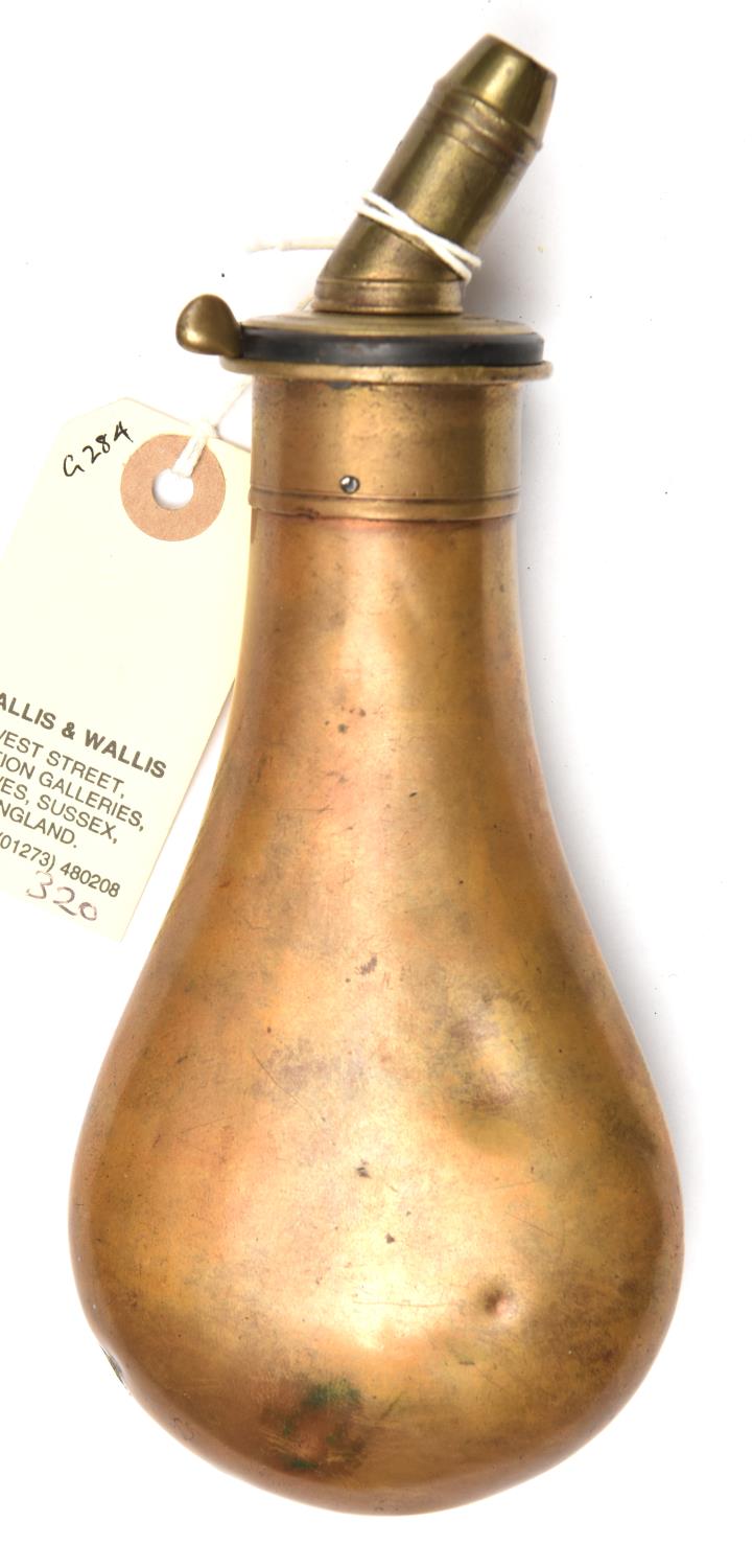 A plain brass powder flask with sloping charger, ‘Patent’ sprung brass top with unmarked 4
