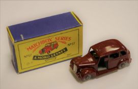 Matchbox Series No.17 Metropolitan TAXI. Example in maroon with tan driver, grey plastic wheels