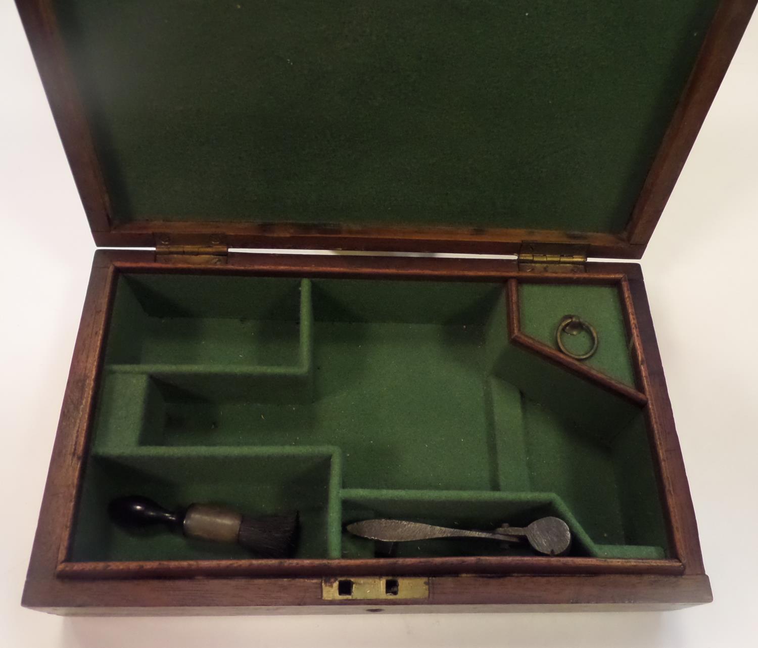 An old darkwood box, adapted to take an unusual shaped pistol, baize lined compartments,