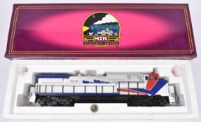 An O Gauge MTH Electric Trains 2-rail American outline Dash-9 diesel locomotive, 2001, in silver,