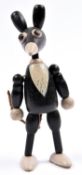 A rare early small articulated wooden Mickey Mouse toy C.1932. Painted in black and white with the